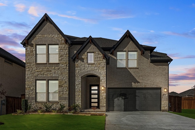 view of front of house with a lawn and a garage