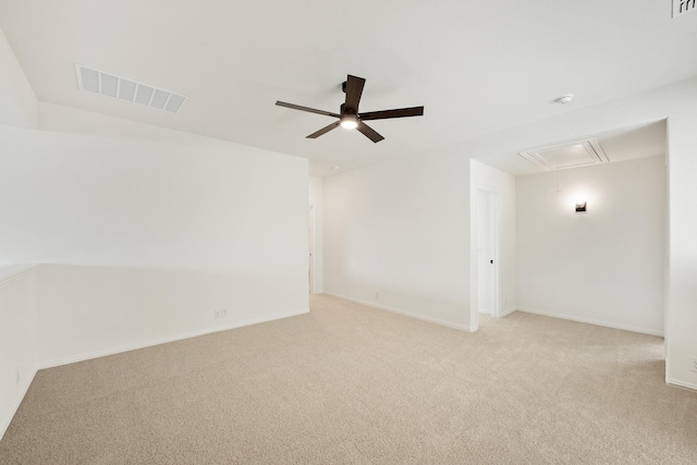 carpeted spare room with ceiling fan