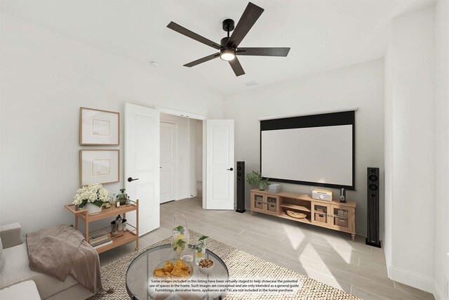 home theater room featuring ceiling fan