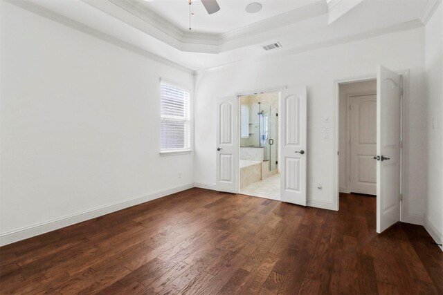 unfurnished bedroom with ensuite bath, ceiling fan, hardwood / wood-style flooring, and ornamental molding