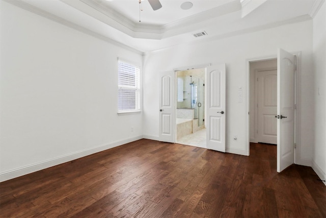 8604 Grassland Dr, Mckinney, TX 75070 - unfurnished bedroom with wood finished floors, visible vents, baseboards, crown molding, and a raised ceiling