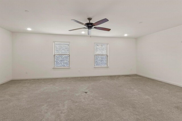 empty room featuring carpet and ceiling fan