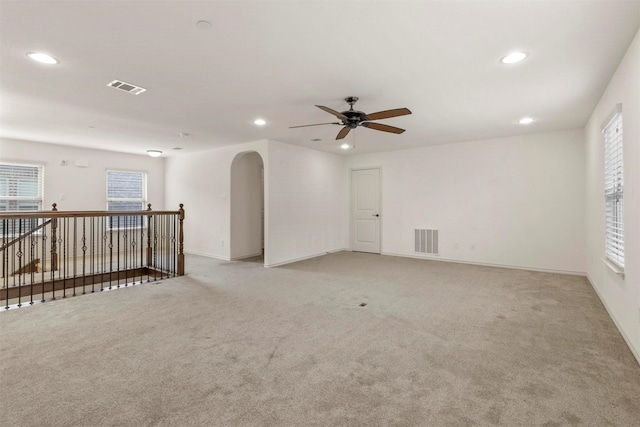 8604 Grassland Dr, Mckinney, TX 75070 - spare room featuring arched walkways, visible vents, recessed lighting, and a ceiling fan