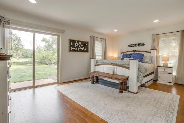 bedroom featuring light hardwood / wood-style floors and access to outside