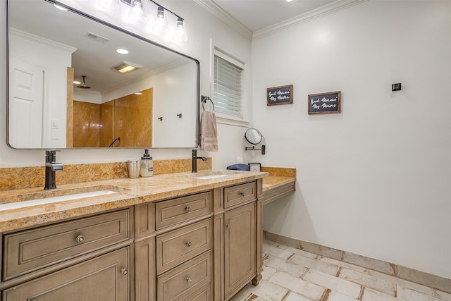 bathroom featuring ornamental molding and double sink vanity