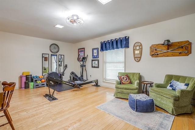 workout area with wood-type flooring