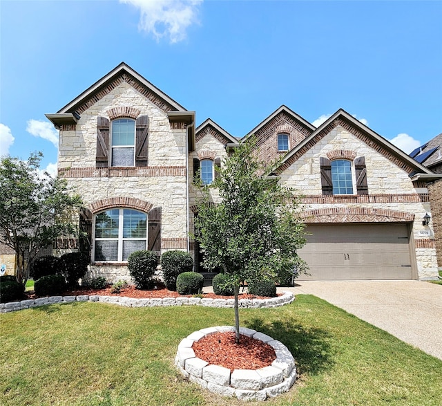 view of front of house featuring a garage and a front yard