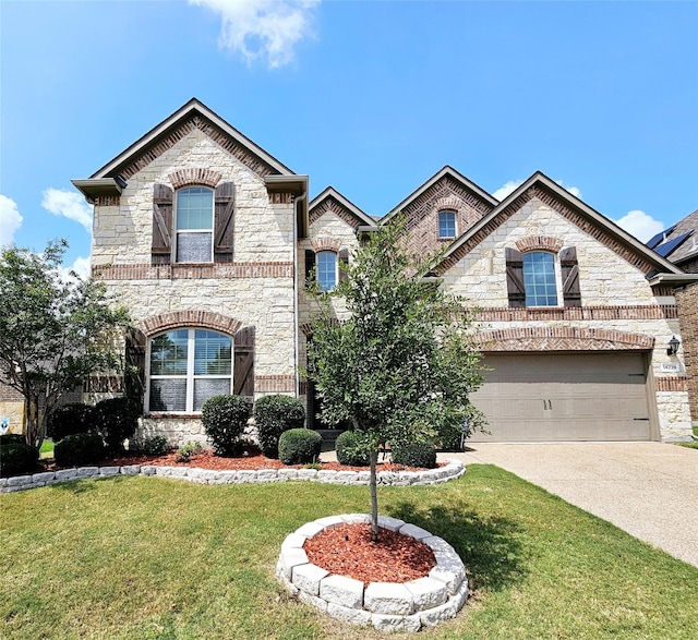 view of front of home with a garage and a front yard