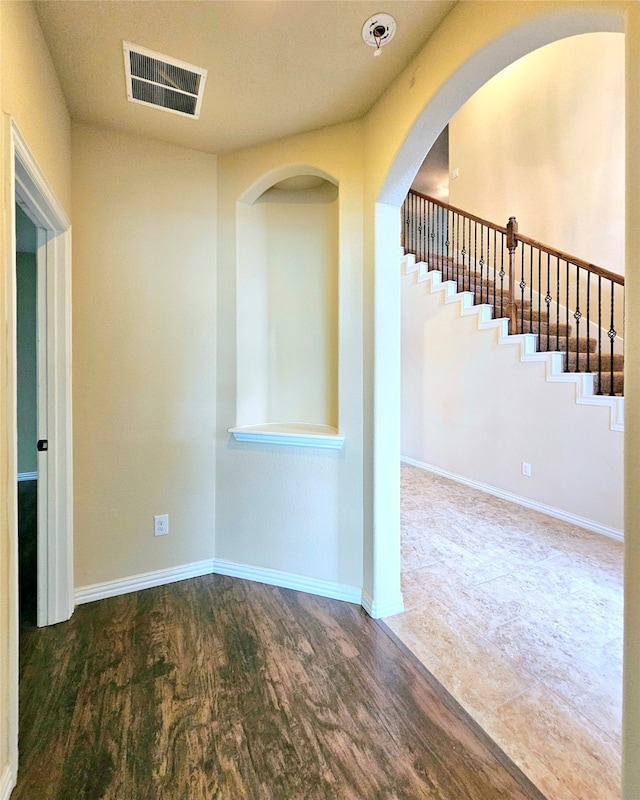 spare room with hardwood / wood-style floors