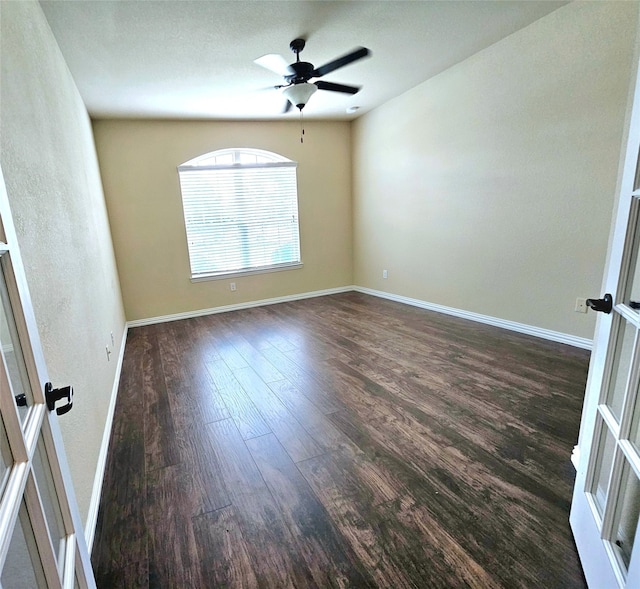 spare room with ceiling fan and wood-type flooring