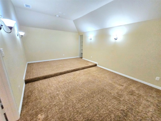 14229 Alis Ln, Frisco, TX 75035 - additional living space featuring visible vents, baseboards, built in features, vaulted ceiling, and carpet floors