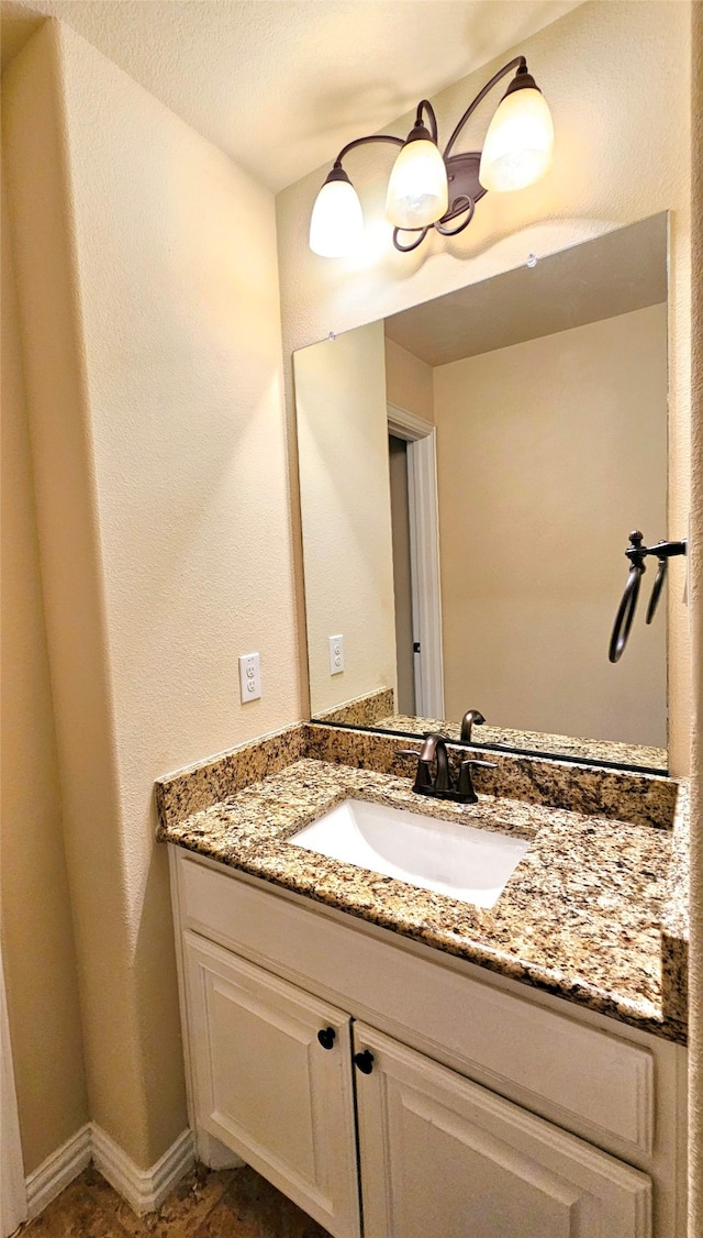 bathroom with vanity and tile patterned flooring