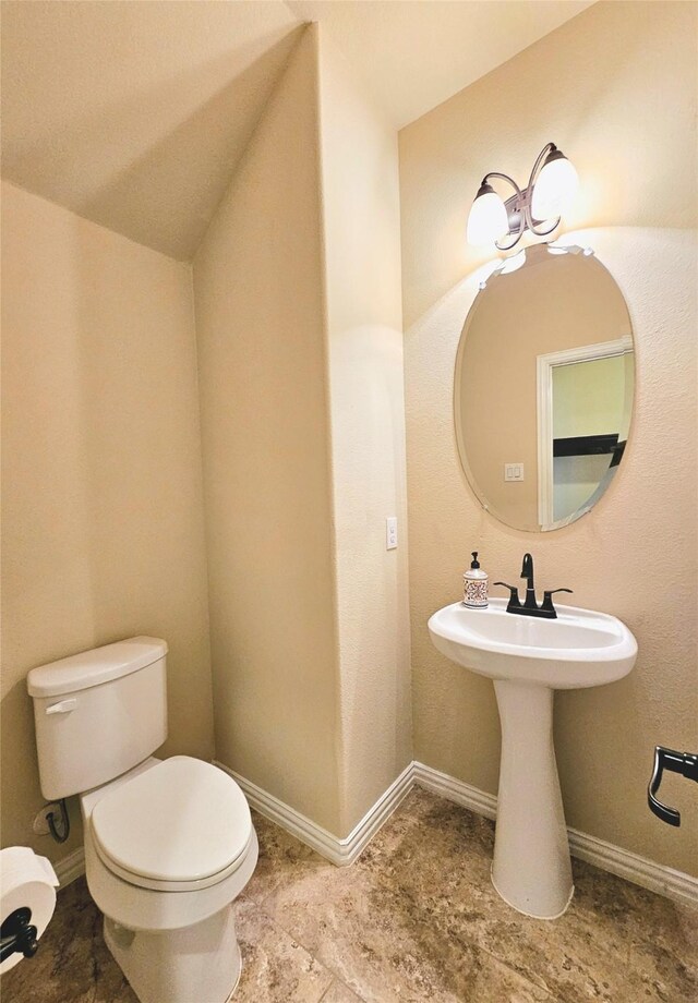 bathroom with tile patterned floors and toilet