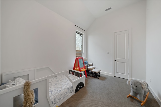 bedroom featuring lofted ceiling and carpet floors