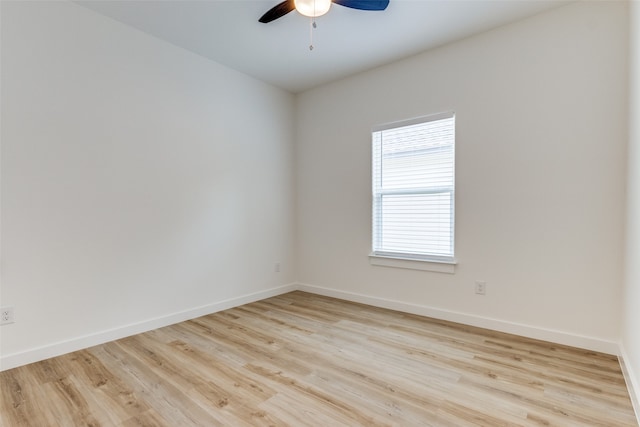 empty room with light hardwood / wood-style floors and ceiling fan