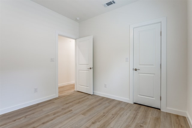 unfurnished bedroom featuring light wood-type flooring