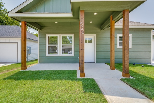 property entrance with a yard