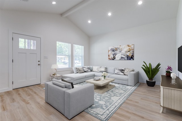 living room featuring high vaulted ceiling, light hardwood / wood-style floors, and beamed ceiling