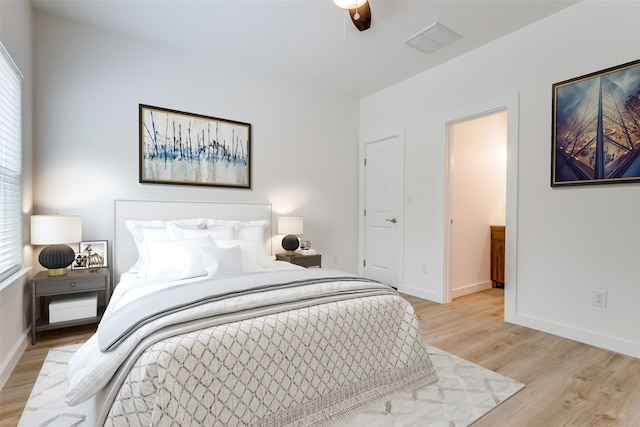 bedroom featuring light hardwood / wood-style floors and ceiling fan