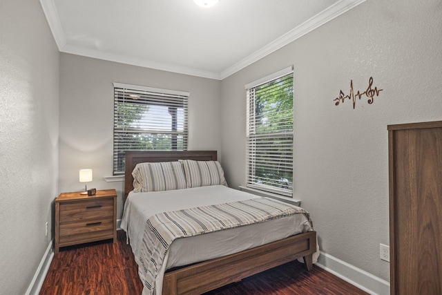 bedroom with crown molding and dark hardwood / wood-style floors