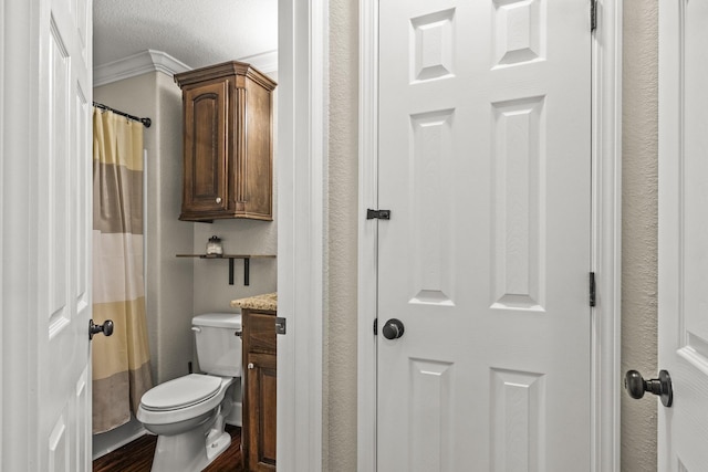 bathroom featuring walk in shower, vanity, and toilet