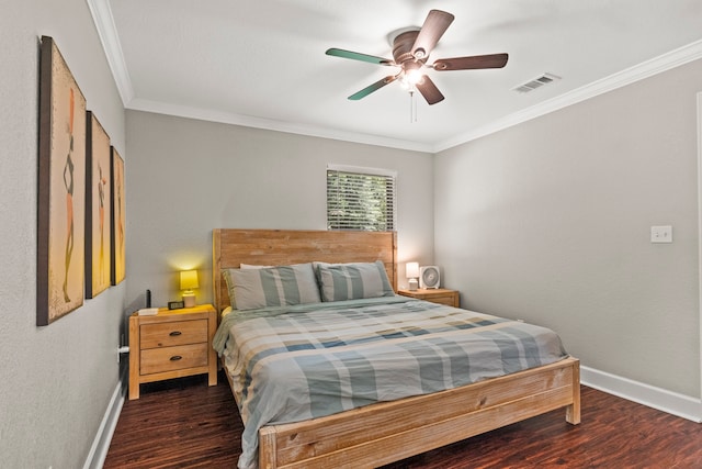 bedroom with dark hardwood / wood-style floors, ornamental molding, and ceiling fan