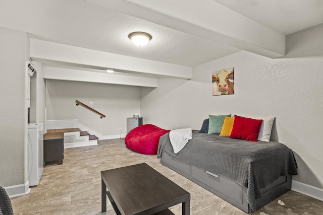 interior space featuring washer / dryer and a textured ceiling