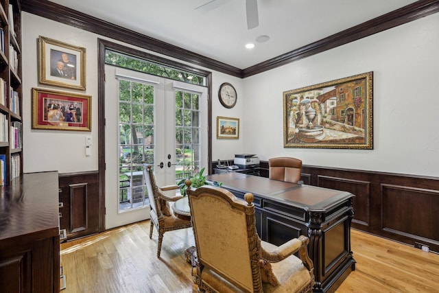 office area with crown molding, french doors, ceiling fan, and light wood-type flooring