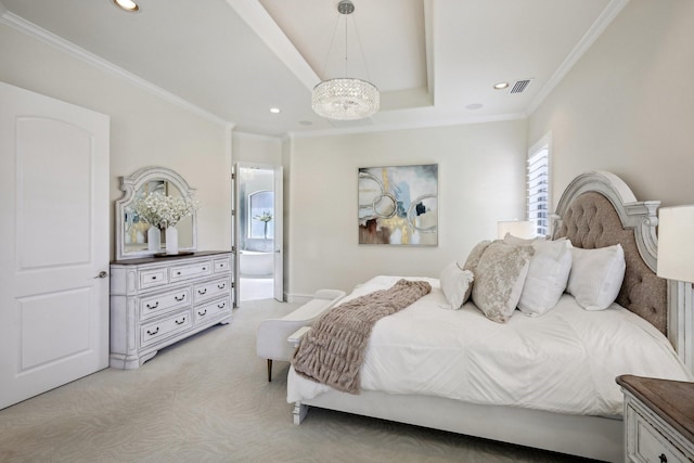 carpeted bedroom featuring an inviting chandelier, a tray ceiling, ensuite bath, and ornamental molding