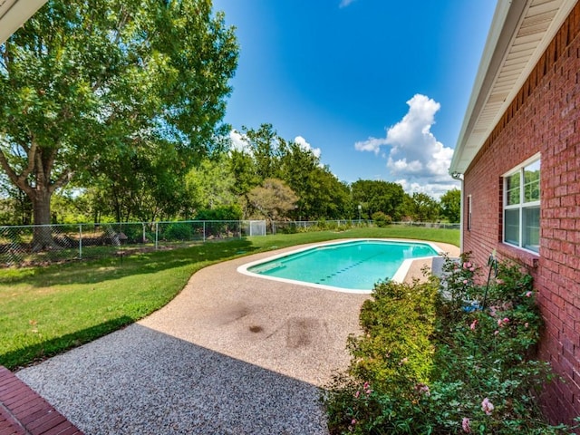 view of pool with a yard, a fenced in pool, a fenced backyard, and a patio area