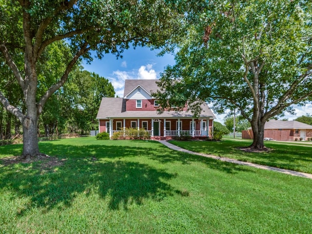 view of front facade featuring a front yard and a porch