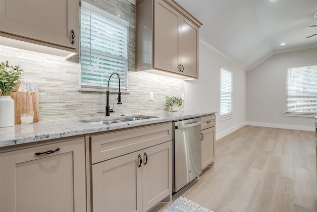 kitchen with stainless steel dishwasher, tasteful backsplash, light wood-type flooring, ornamental molding, and sink