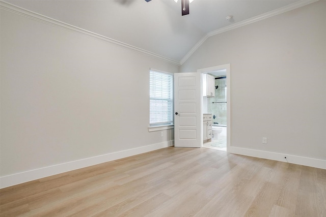 spare room featuring crown molding, ceiling fan, vaulted ceiling, and light hardwood / wood-style flooring