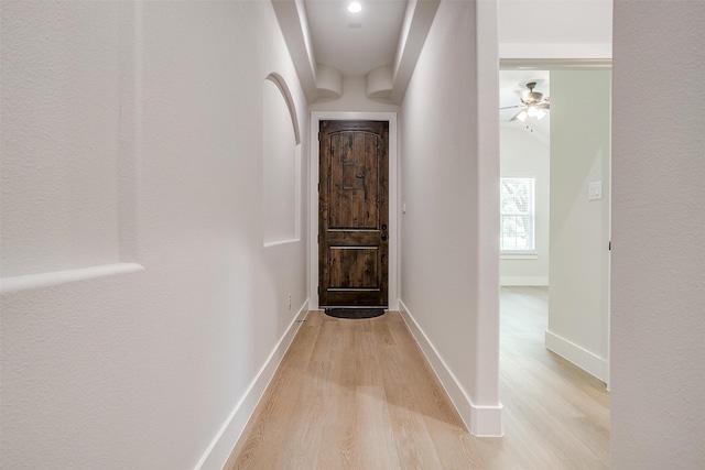 hall with light hardwood / wood-style floors