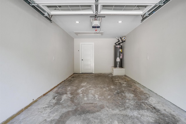 garage featuring electric water heater and a garage door opener