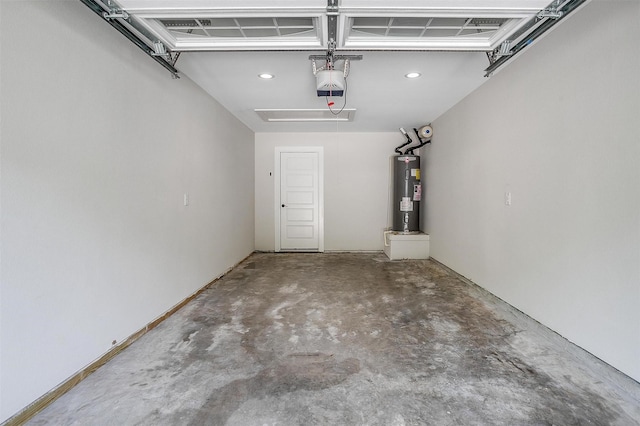 garage featuring a garage door opener and water heater