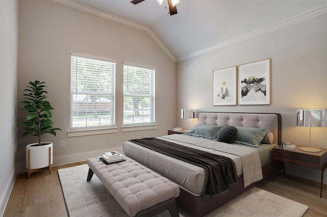 bedroom with ceiling fan, vaulted ceiling, hardwood / wood-style floors, and ornamental molding