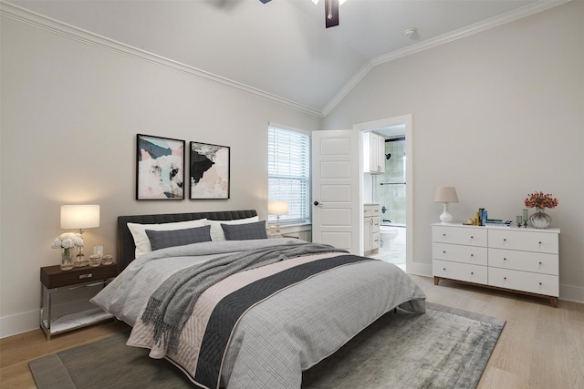 bedroom with light hardwood / wood-style flooring, vaulted ceiling, connected bathroom, ceiling fan, and ornamental molding