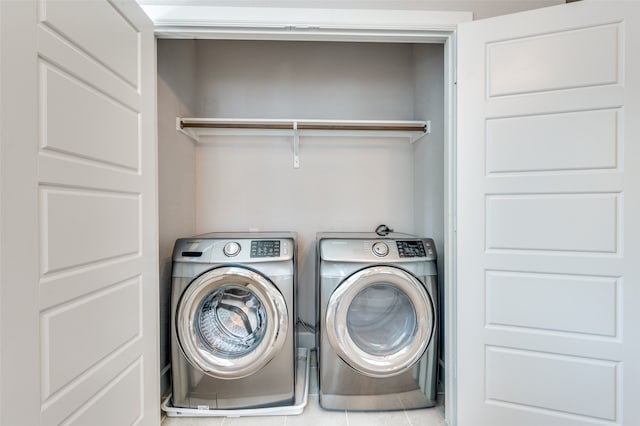 laundry area with independent washer and dryer