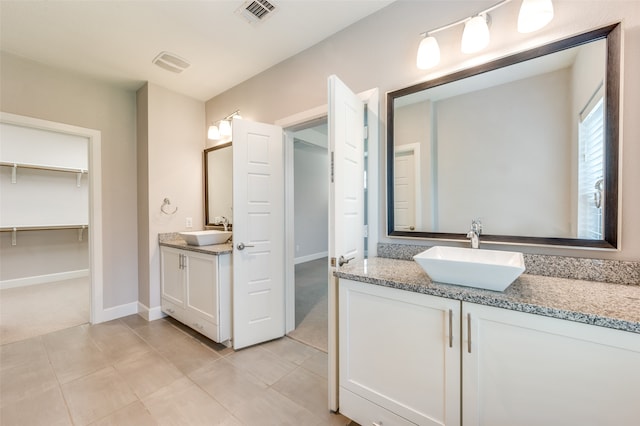 bathroom with tile patterned floors and vanity