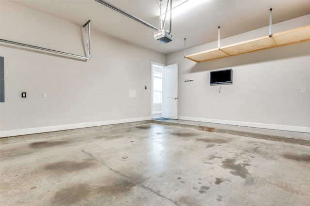 garage featuring a garage door opener and electric panel