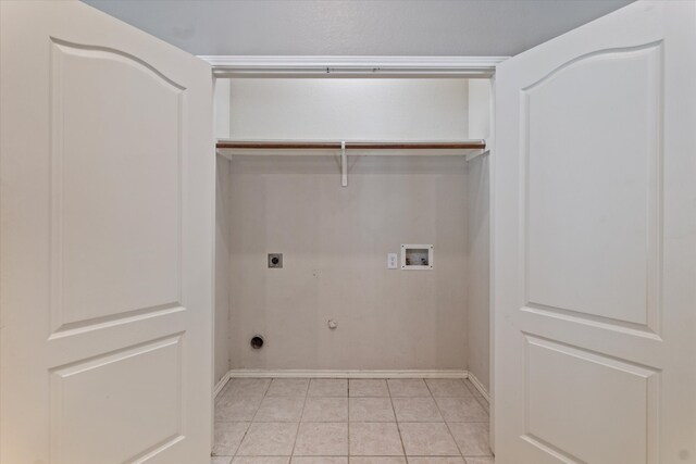 laundry room featuring hookup for an electric dryer, gas dryer hookup, washer hookup, and light tile patterned floors