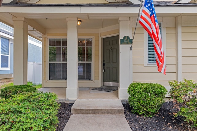 entrance to property featuring covered porch