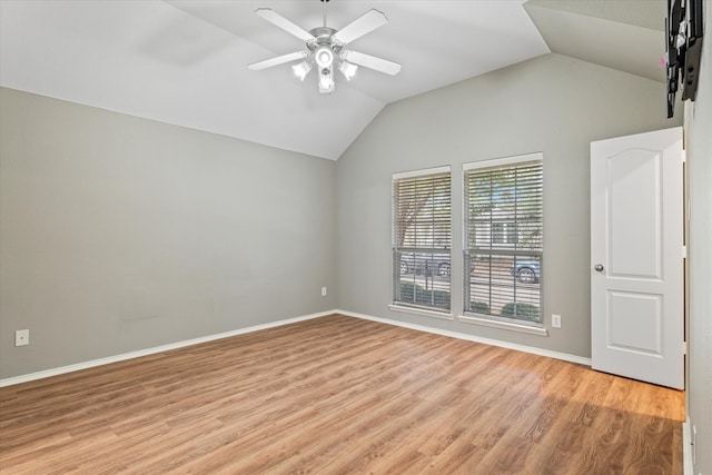 unfurnished room with light hardwood / wood-style flooring, ceiling fan, and vaulted ceiling