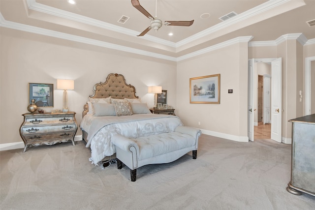 bedroom with ceiling fan, crown molding, and a tray ceiling