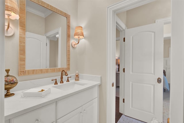 bathroom featuring vanity and ornamental molding