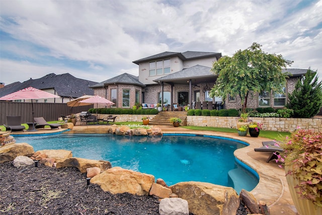 view of swimming pool with a patio area