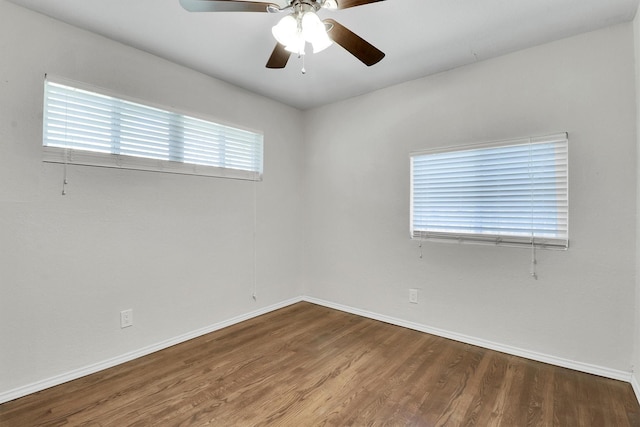 spare room featuring hardwood / wood-style flooring and ceiling fan