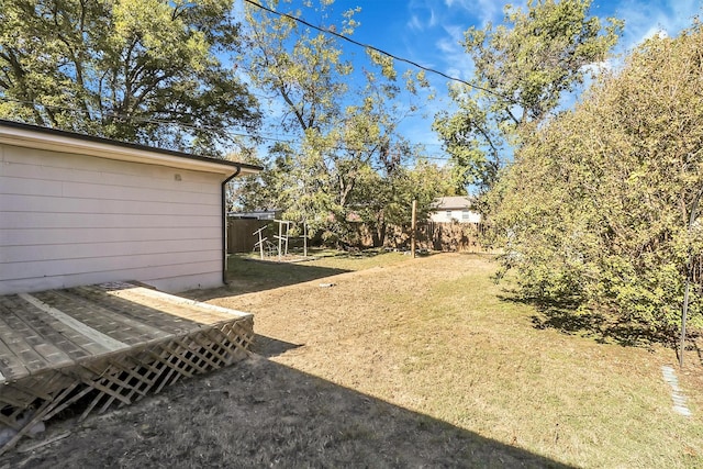 view of yard featuring a wooden deck