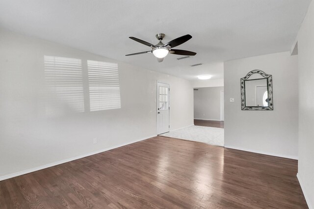 spare room with wood-type flooring and ceiling fan